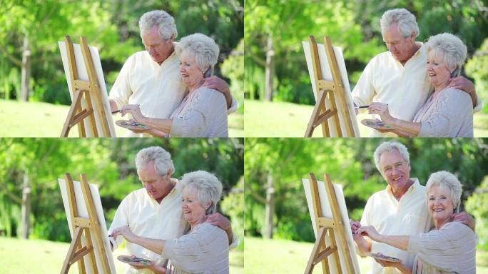 退休夫妇一起在外面画画