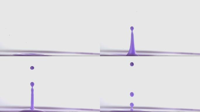 紫色颜料滴在颜料上的慢动作
