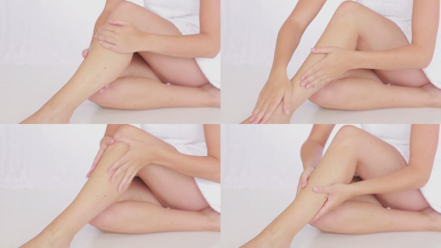 女人在腿上擦药膏护肤美腿大长腿大白腿保养