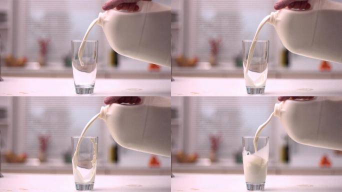 将牛奶倒入厨房的玻璃杯中特写