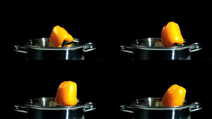 黄辣椒掉进锅里的慢镜头