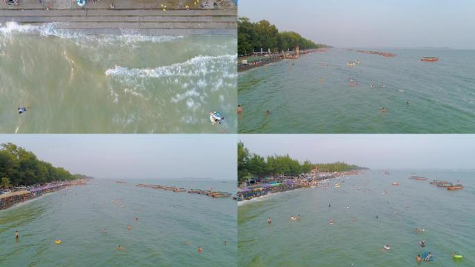 广西防城港市东兴市金滩海岸线游客下海游泳