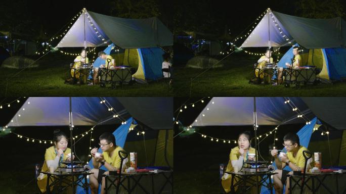 夜晚郊外露营-情侣在帐篷边野炊