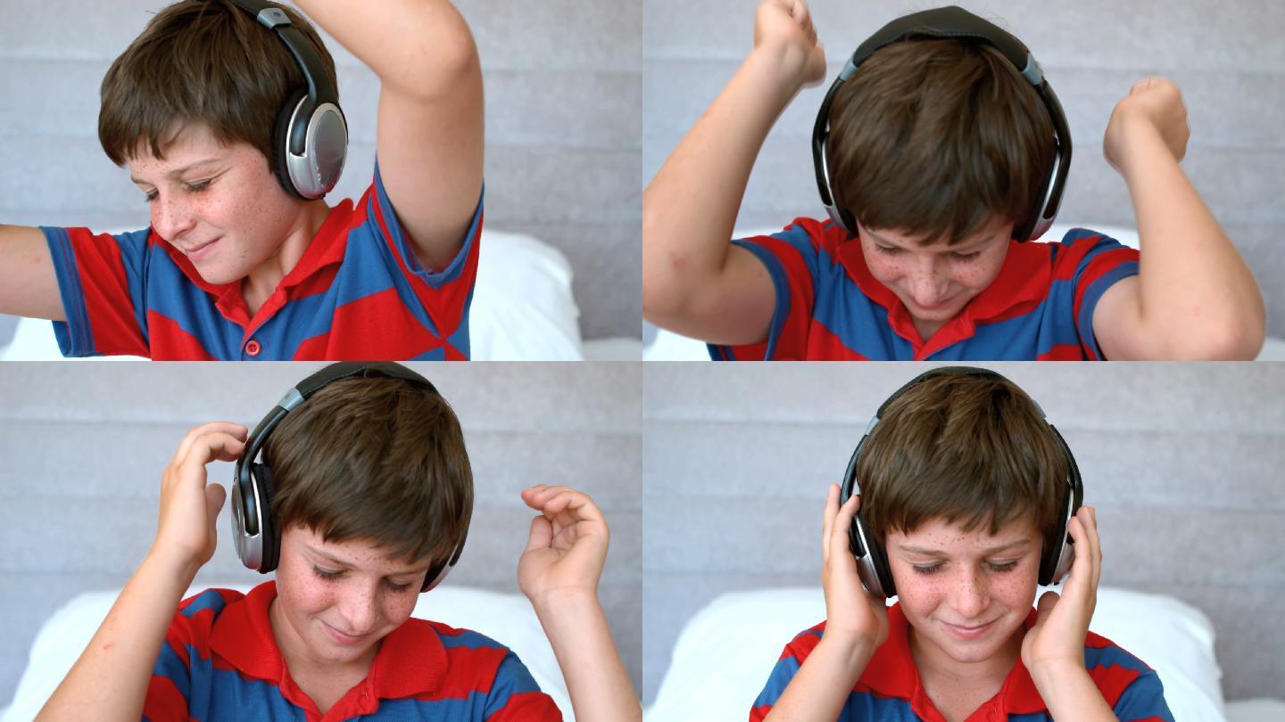 小男孩戴着耳机，以每秒500帧的慢动作欣赏音乐