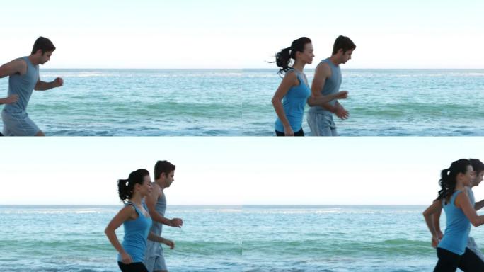 一对情侣在沙滩上跑步锻炼特写