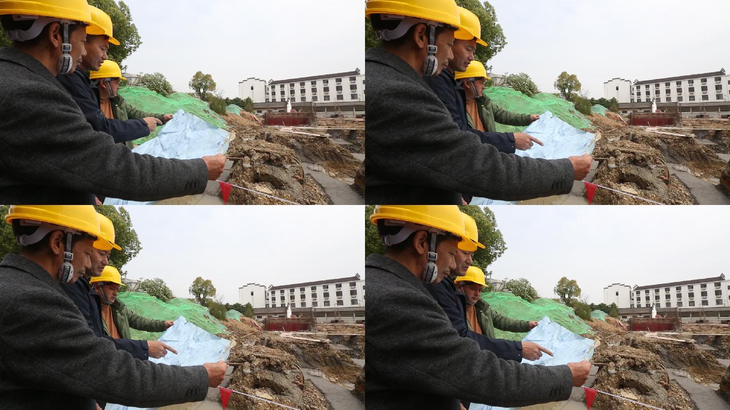 建筑工地工人戴安全头盔看图纸施工实拍素材