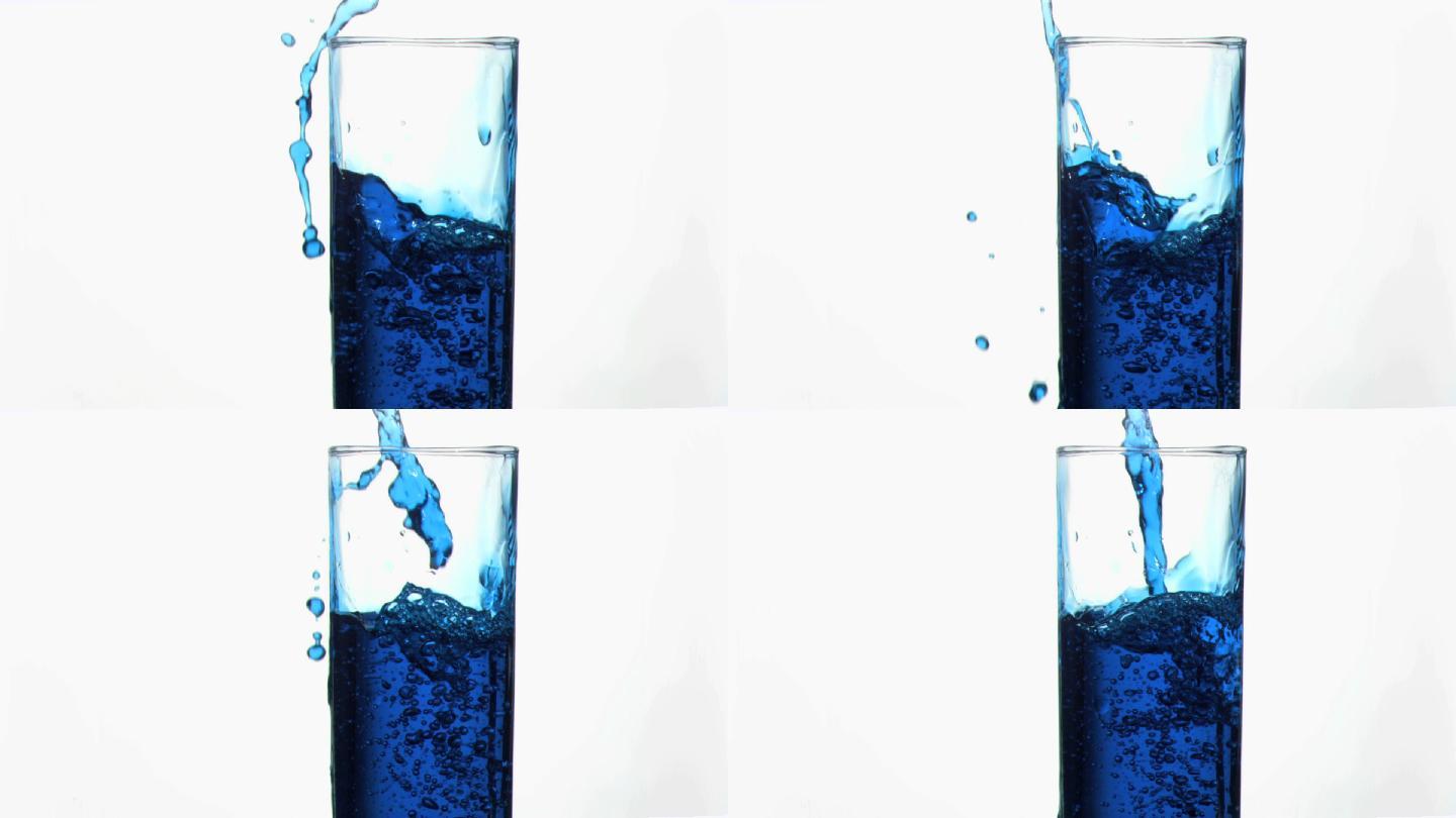 将蓝色液体倒入玻璃杯中特写