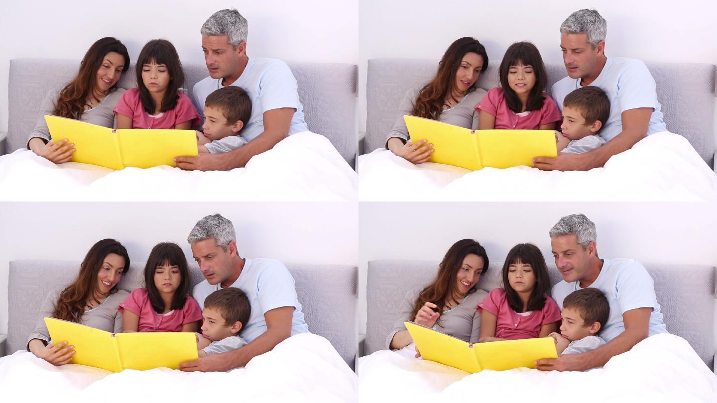 家庭成员在床上读故事