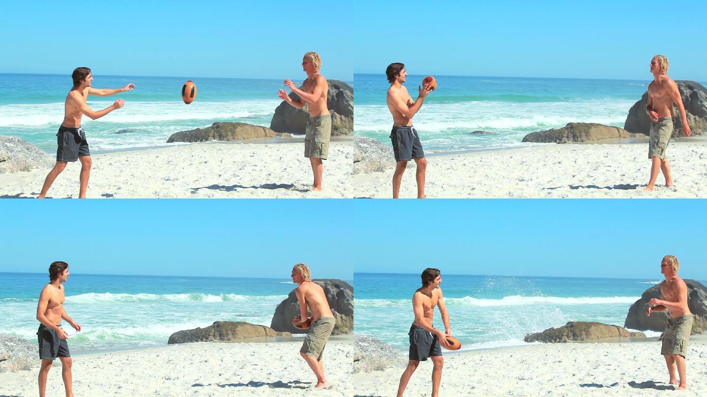 两个人在沙滩上玩橄榄球特写