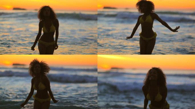夕阳下，快乐的女人在水中跳舞