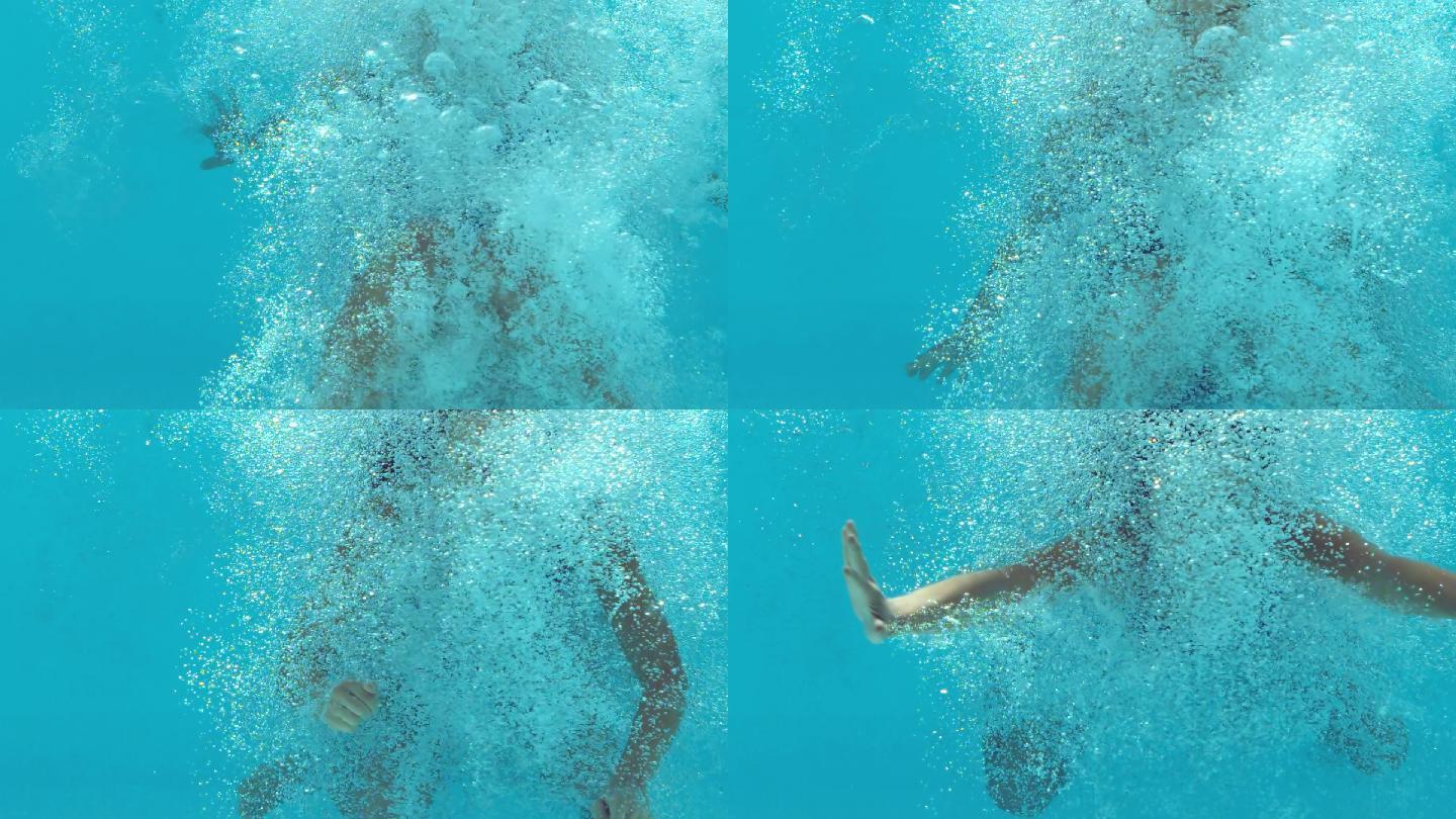 褐发女人在水下漂浮在蓝色泳衣在慢动作
