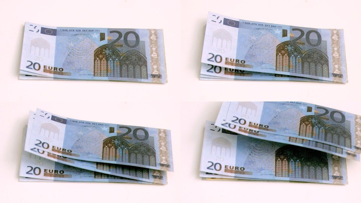 在白色背景下的欧洲钞票上，风以超慢的动作吹着