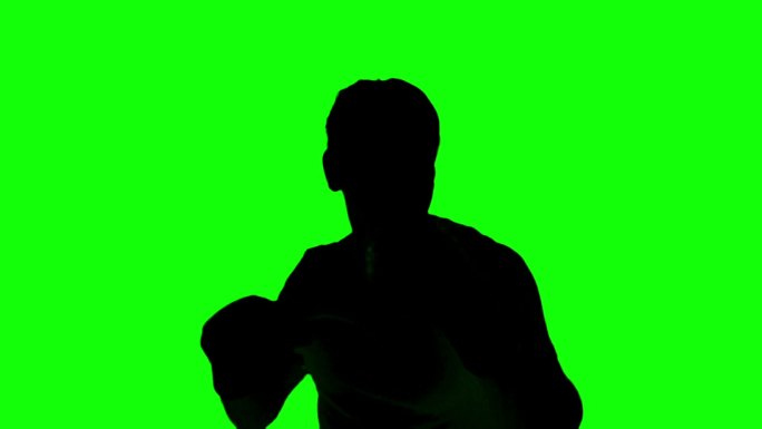 绿色背景下黑色男人剪影打拳特效