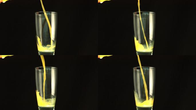 慢镜头里，橙汁倒在杯子里