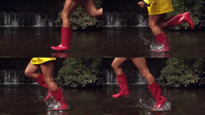 穿着粉色胶靴的女人在水里奔跑，溅起水花