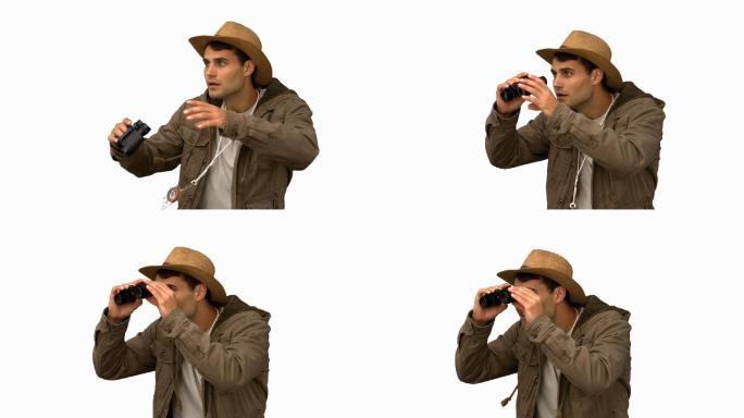 一名身穿外套的男子用望远镜在白屏上慢动作拍摄