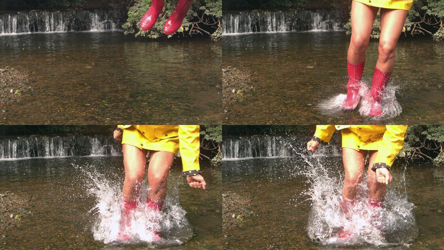 瀑布前女子跳入水中的慢动作