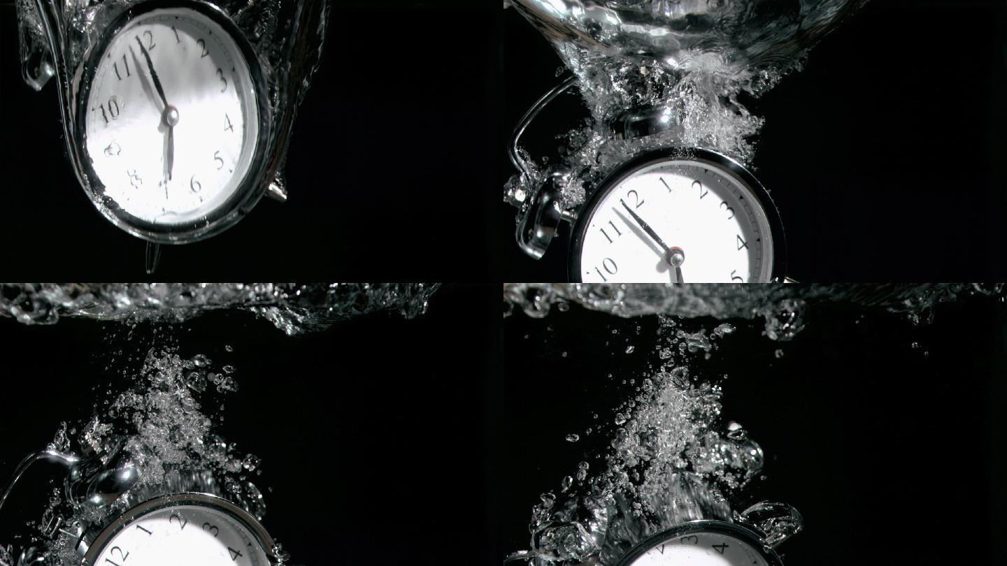 闹钟在一个超级缓慢的运动在黑色的背景下落入水中