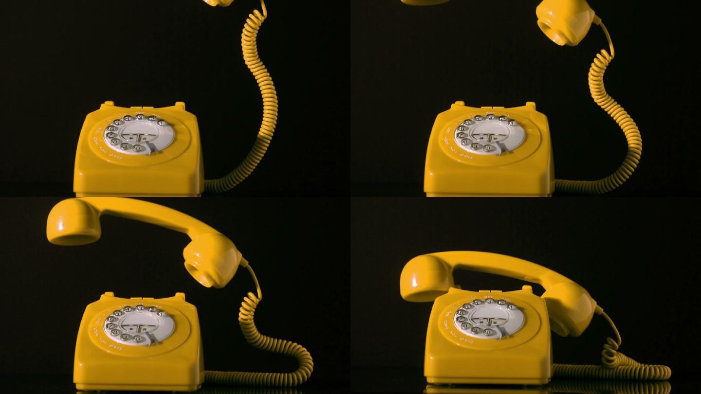 黄色电话的听筒器掉落在电话上特写