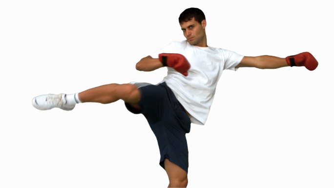 男人在白色背景下戴着拳击手套打拳特写