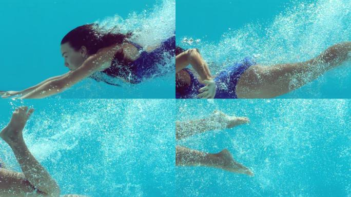 深色头发的女人在水下慢动作游泳