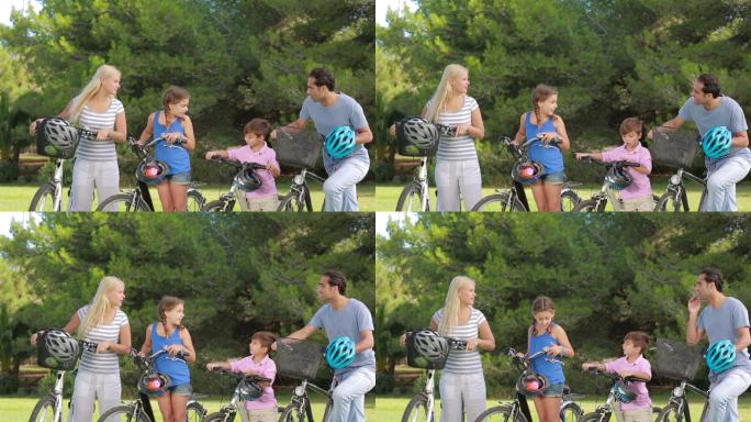 一家人一起在公园里骑自行车特写