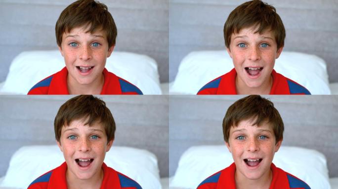 蓝眼睛的男孩在500帧每秒的慢动作中感到惊讶