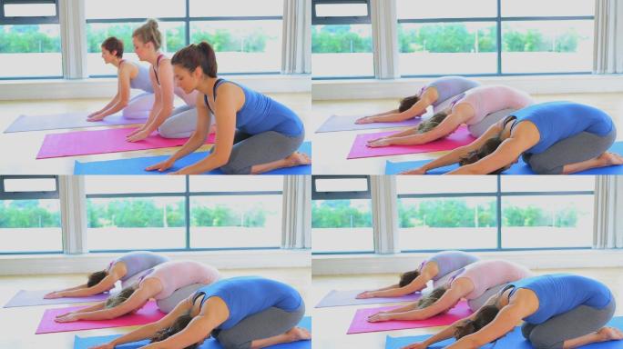 女人们在瑜伽房里健身锻炼特写