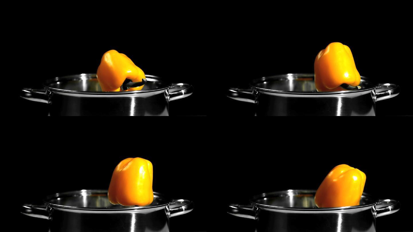 用慢镜头把黄椒掉进锅里