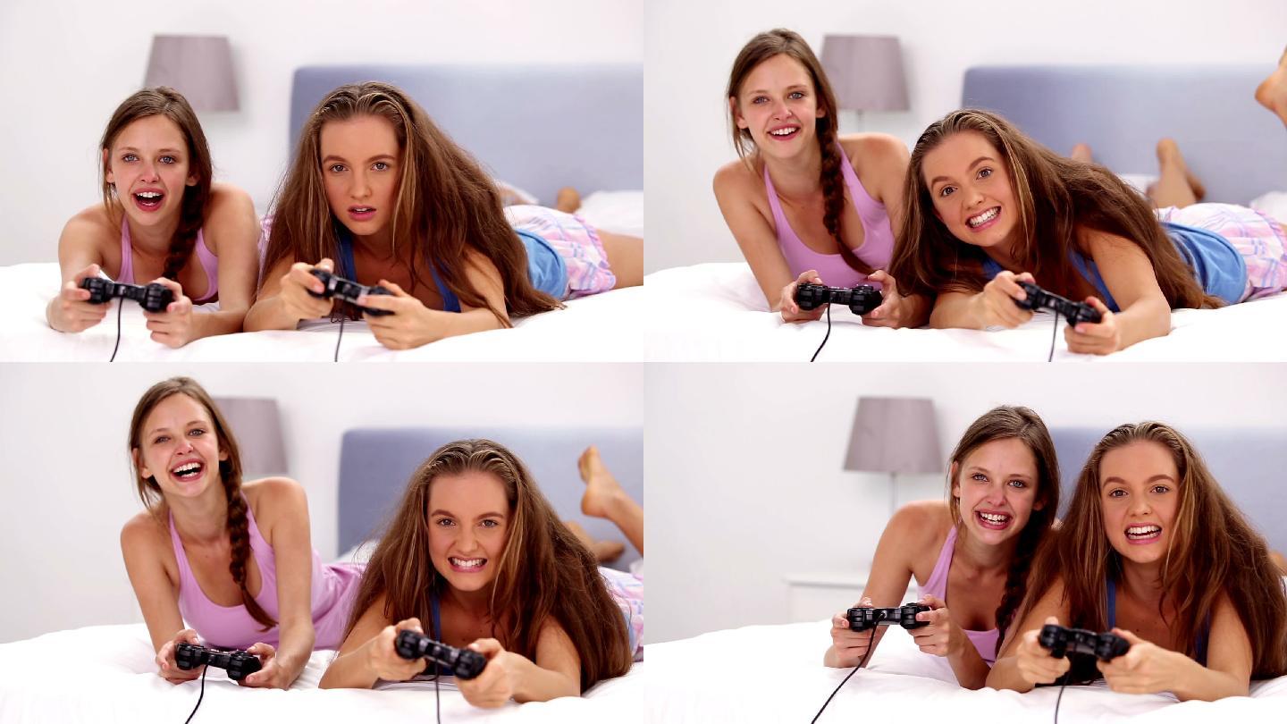 两个女孩在床上打游戏特写