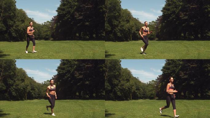 运动的黑发女子在草地上跑步的慢动作