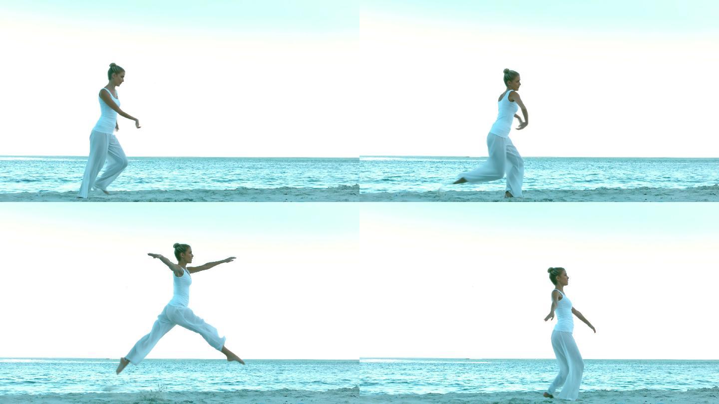 迷人的女人在海滩上慢动作跳舞