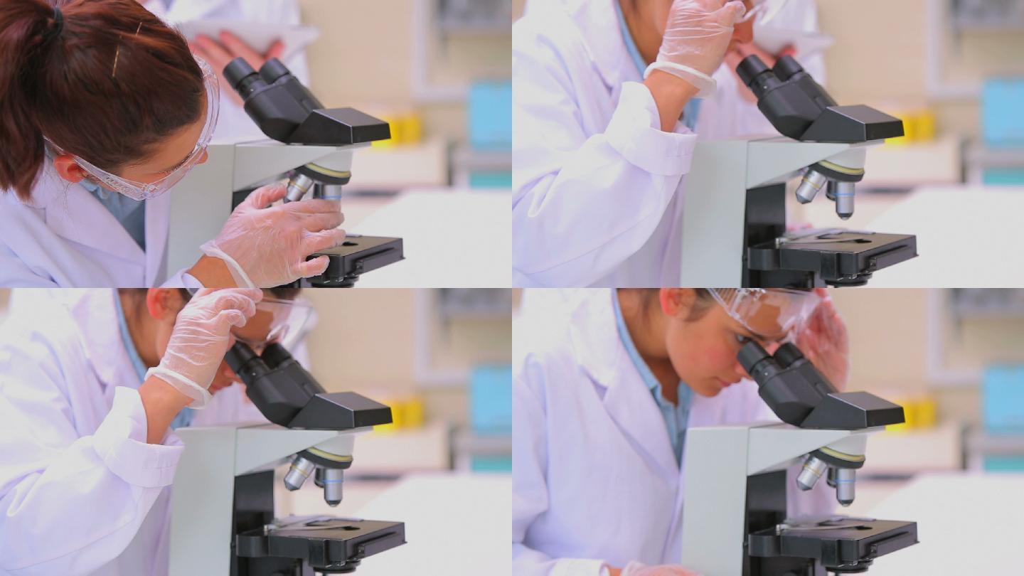 科学家用显微镜做实验