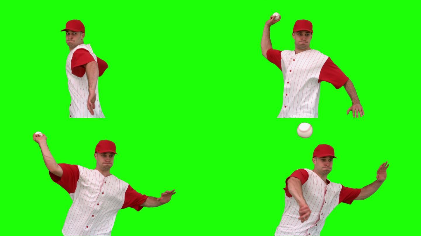 绿色背景下男人在扔棒球特写