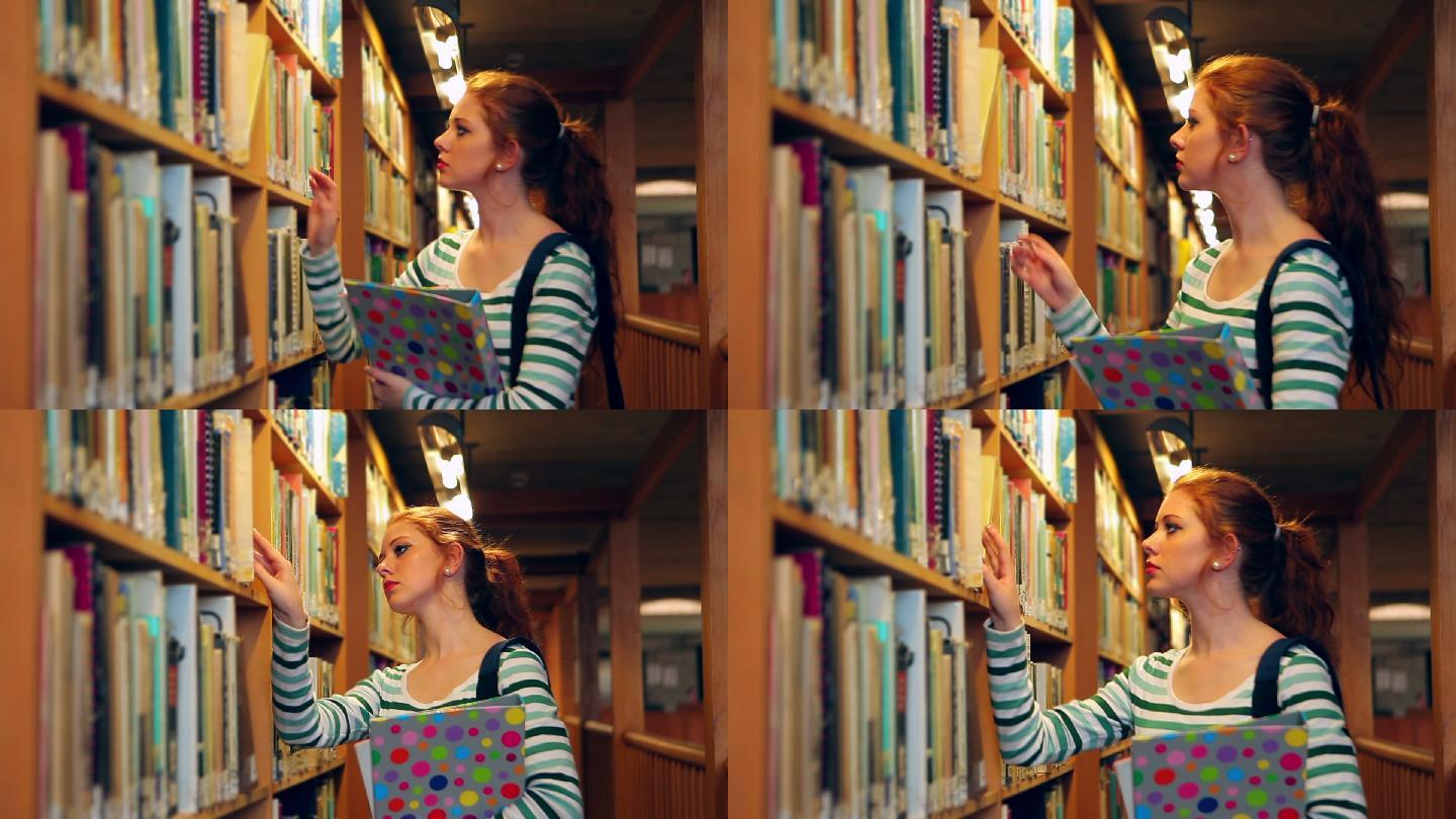 女生在图书馆里挑书特写