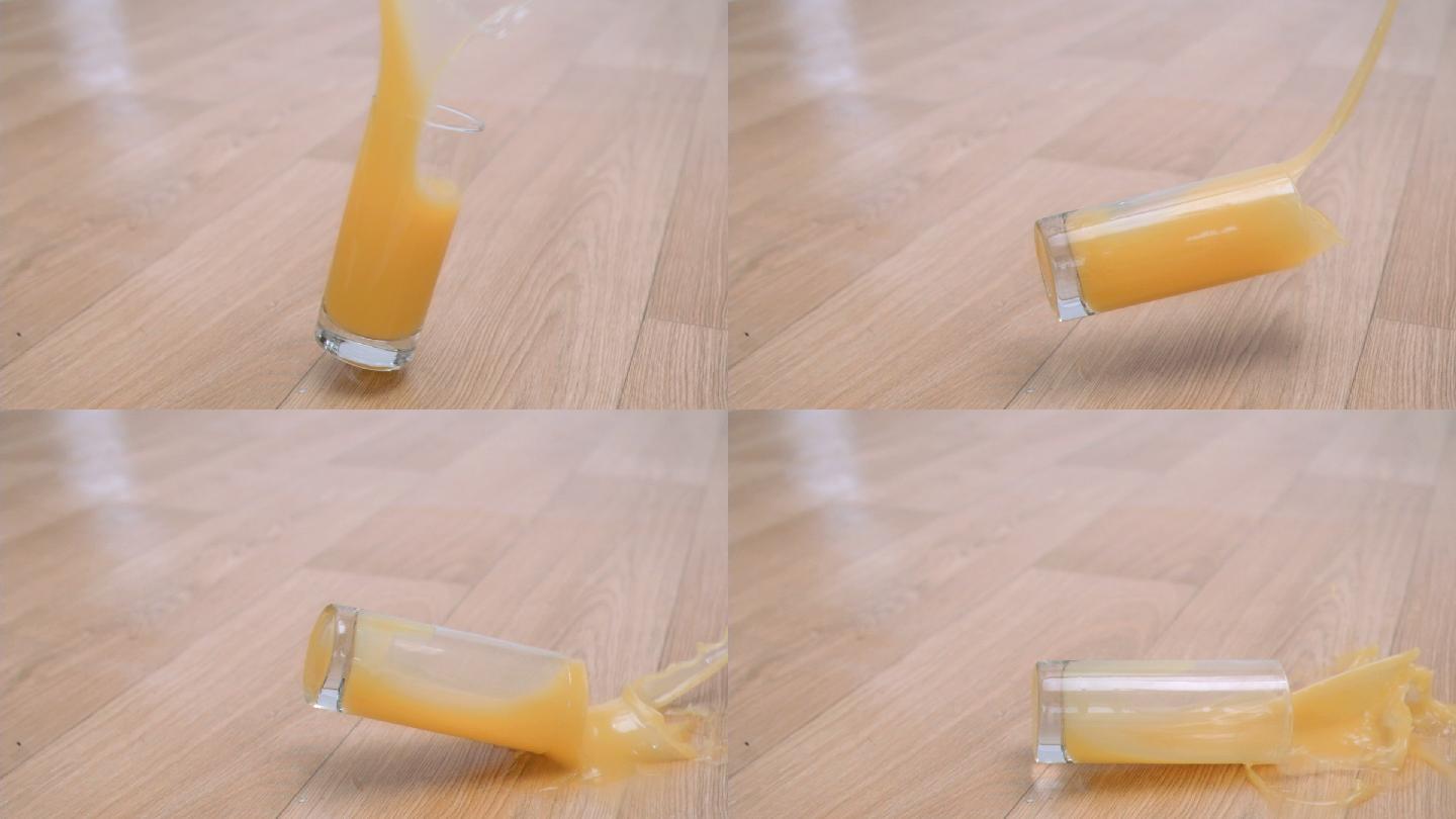 一杯超慢镜头的橙汁掉在地板上