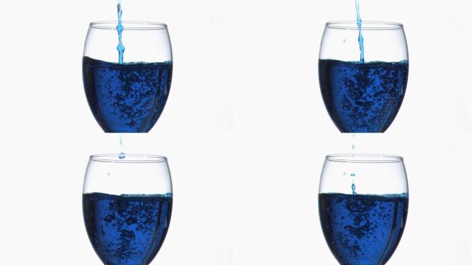 在白色背景的衬托下，蓝色的涓涓细流以超慢的动作流淌在满杯的葡萄酒杯中