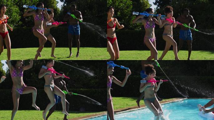 混合种族妇女玩水枪和跳进游泳池的乐趣