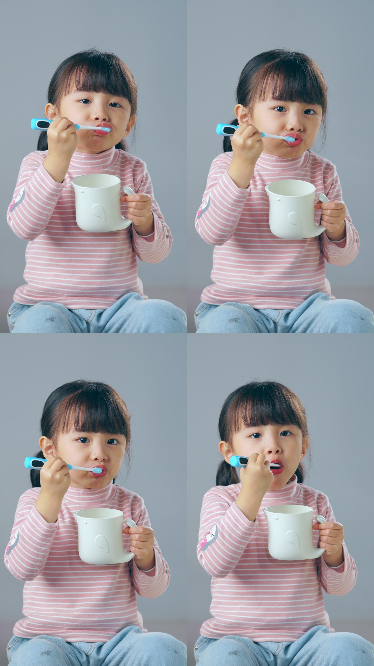 刷牙的小女孩杯子漱口小女孩
