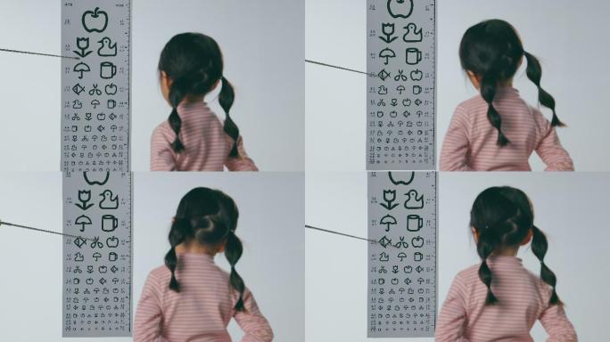 测视力的小女孩爱护眼镜护眼