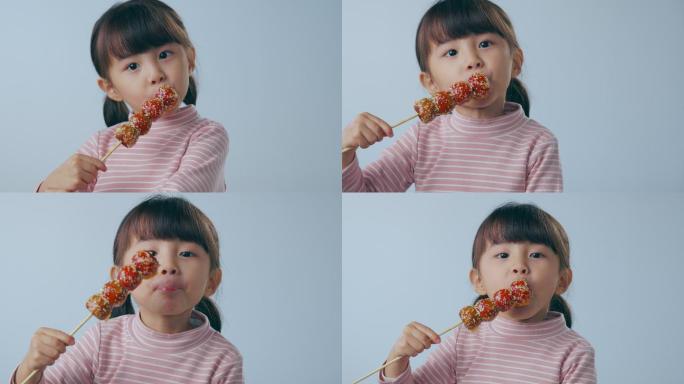 吃糖葫芦的小女孩吃糖葫芦的小女孩童年糖葫