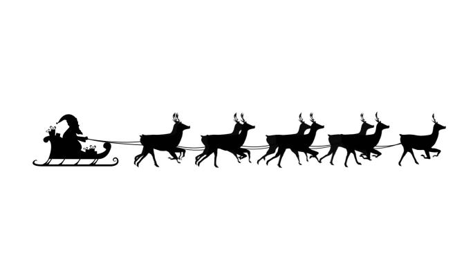 圣诞老人坐在驯鹿拉的雪橇上