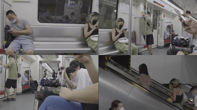 地铁车厢 低头玩手机地铁上班族 广州地铁