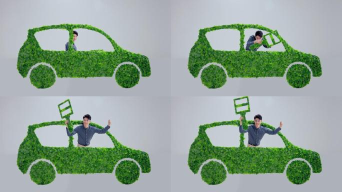 青年男人驾驶绿色环保汽车出行
