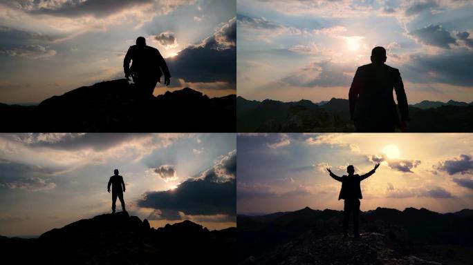 男人成功登顶山顶眺望攀登高峰团队力量登山