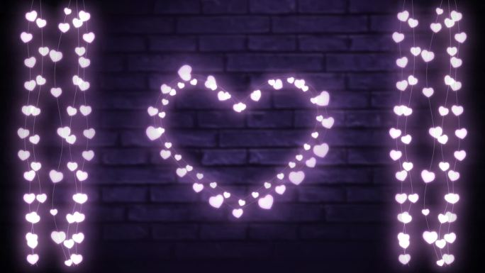 红心和一串串的彩灯挂在砖墙上