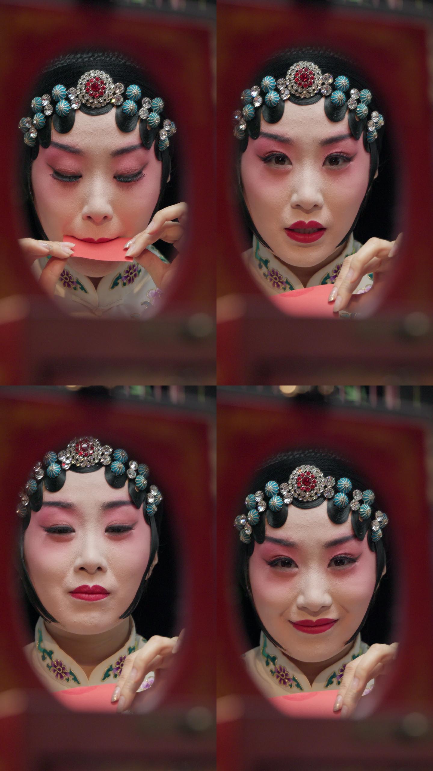 京剧女演员对着镜子化妆