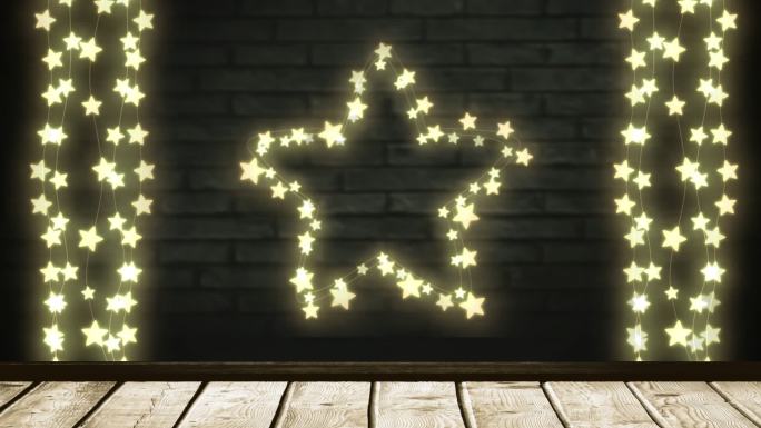 砖墙背景上闪烁的星星和一串串的仙女灯