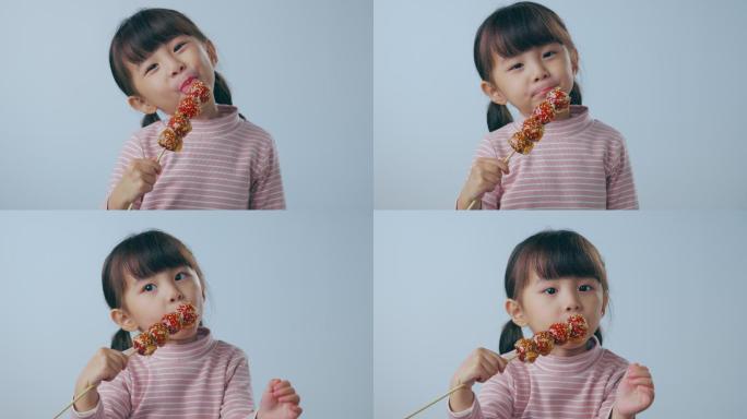 吃糖葫芦的小女孩快乐童年零食冰糖葫芦儿童