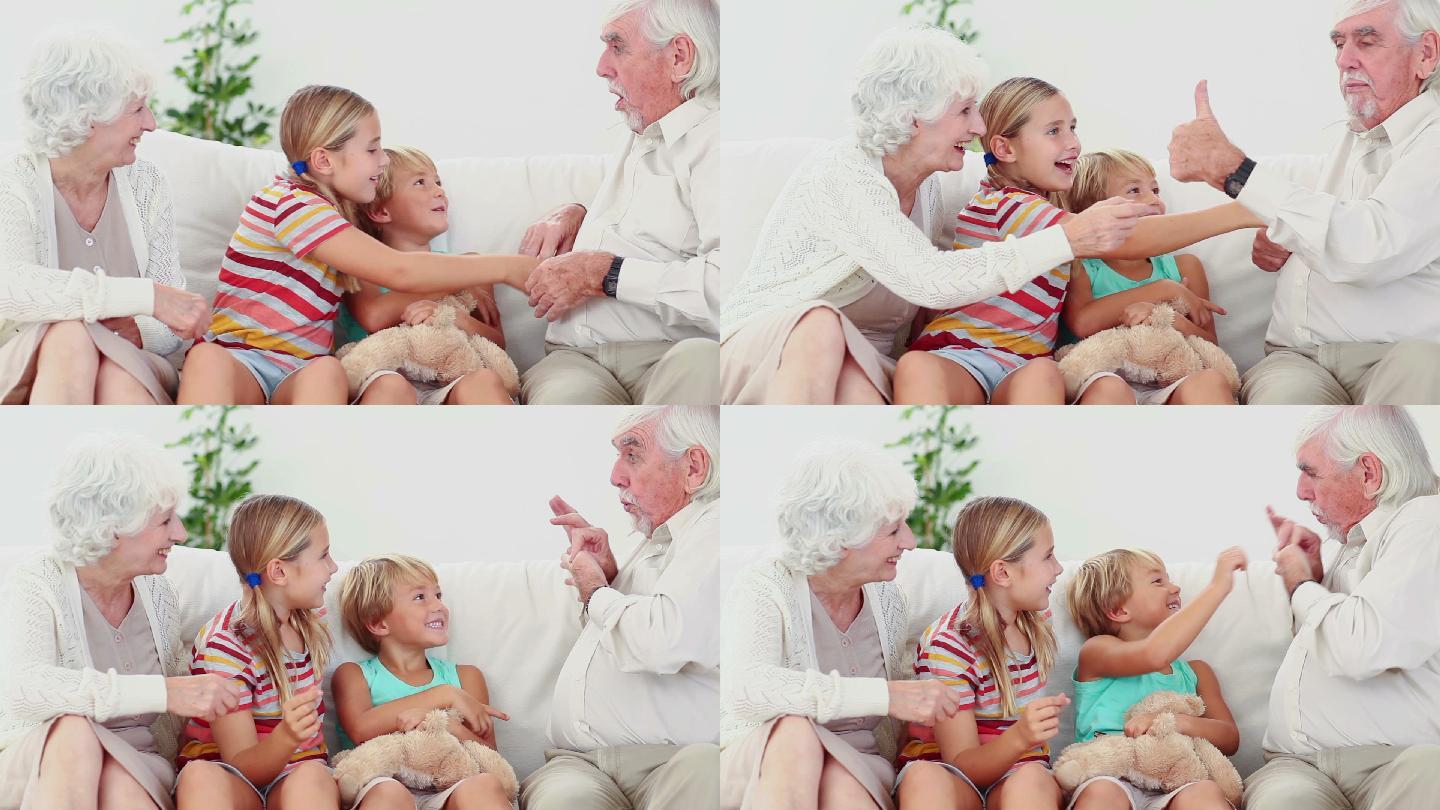 Children playing with grandparents on the couch